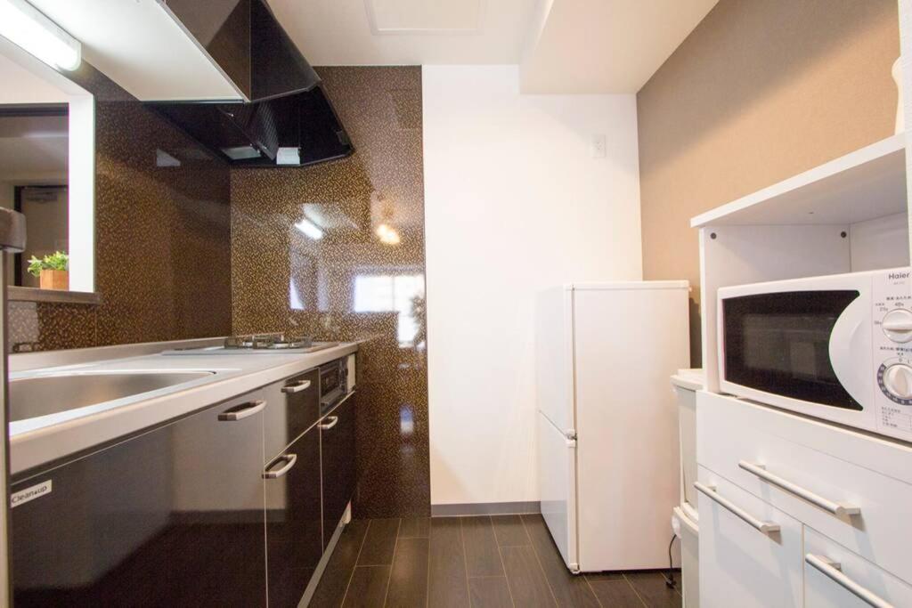 ようこそ札幌へ! 大通公園まで地下鉄10分 定員6名 Firetv完備 1階はセコマ Apartamento Exterior foto